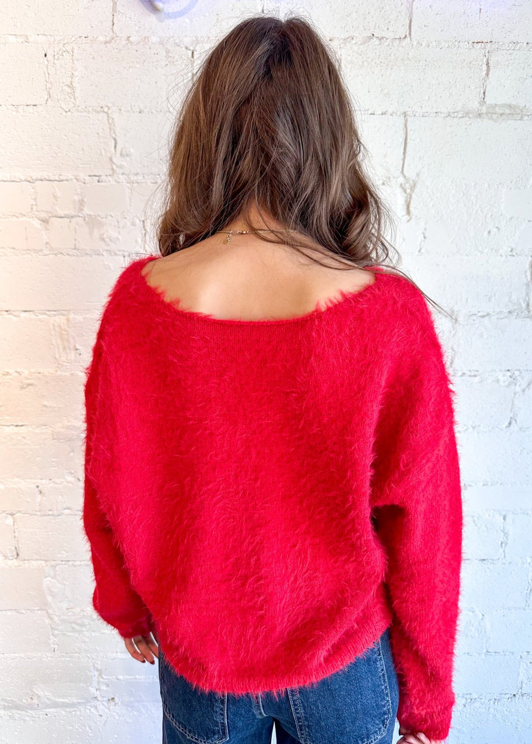 Red bow sweater
Women's knitwear
Cozy fashion
Playful charm
Elegant details
Dallas boutique
Versatile styling
Seasonal wardrobe
Statement piece
Fashion-forward design