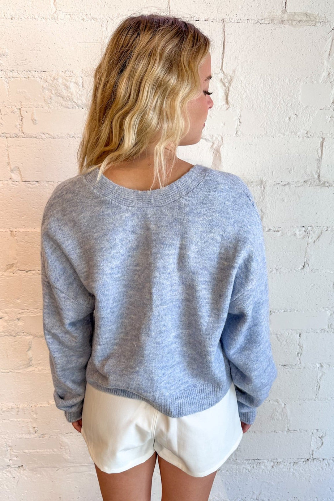 Statement bow detail at the back for a feminine flair
Soft, breathable fabric for comfort
Relaxed fit with a flattering silhouette
Gorgeous blue color for versatile styling