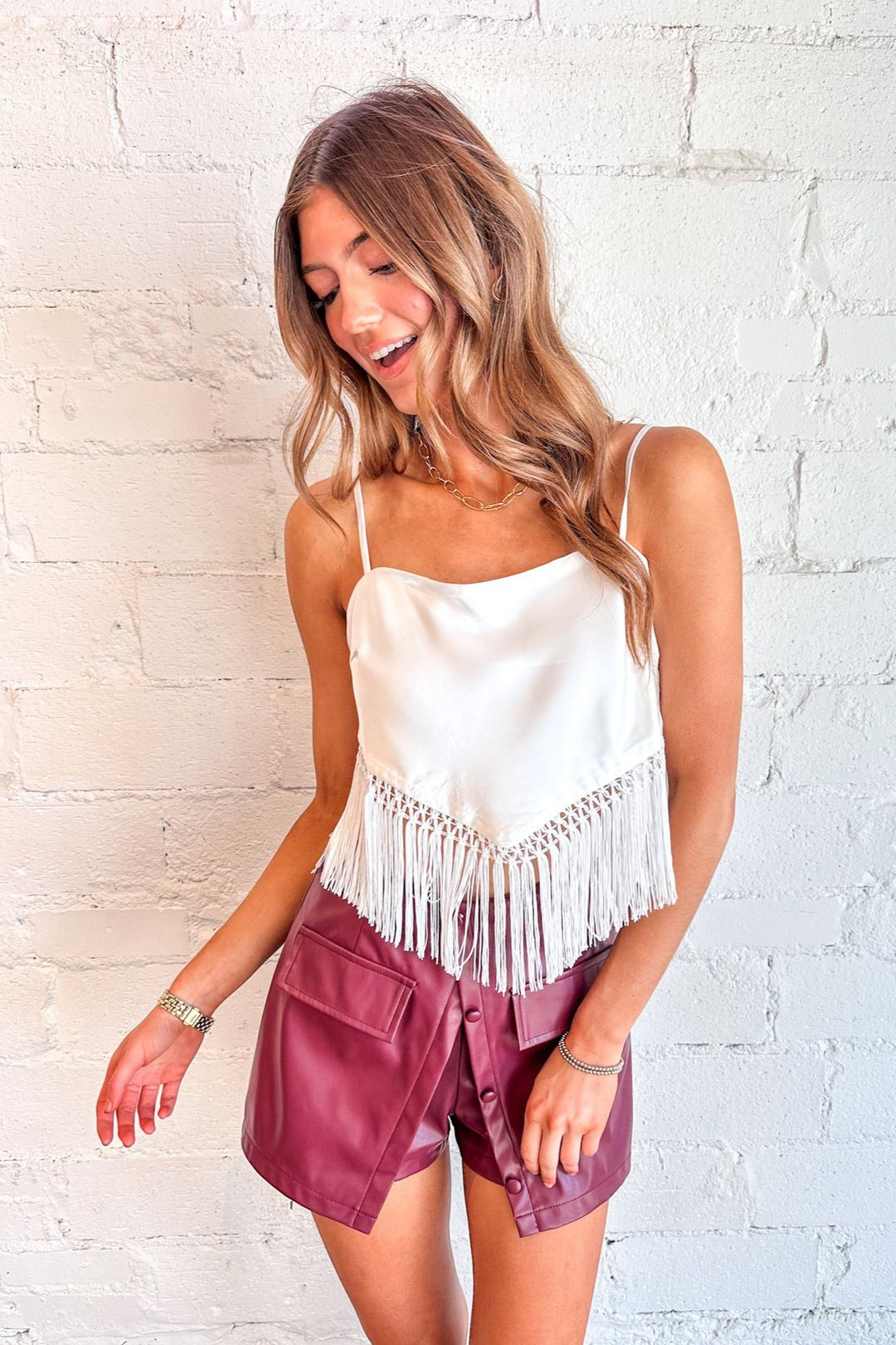 Available in rich sienna and crisp white
Fringe detailing for a boho-inspired touch
Tie-back design for a playful, open-back look
Lightweight fabric for year-round versatility